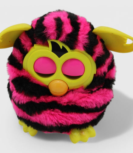 Furby Boom toy with pink and black stripes and yellow ears