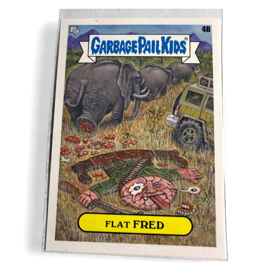 A near mint 2021‑2023 Topps Garbage Pail Kids “Flat Fred” Famous Landmarks insert card number 4B, showing cartoon gory safari scene with elephants.  
