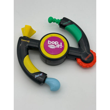 Hasbro Bop It Extreme Electronic Game showing flick, twist, pull, and spin features
