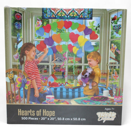 The Hearts of Hope 500-piece jigsaw puzzle by Toynk Originals features a heartwarming scene of children crafting paper hearts, measuring 20″×20″ and perfect for ages 7+.
