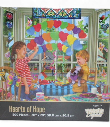 Front view of Hearts of Hope 500-piece jigsaw puzzle box showing colorful heart scene