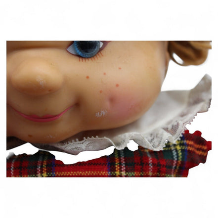 Heather doll's back view showing tartan dress