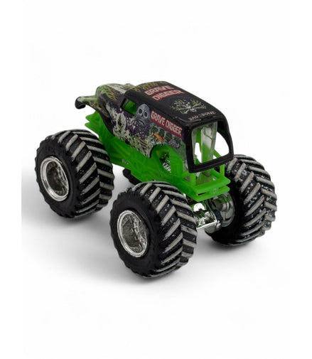 Side view of Grave Digger diecast truck in black and green