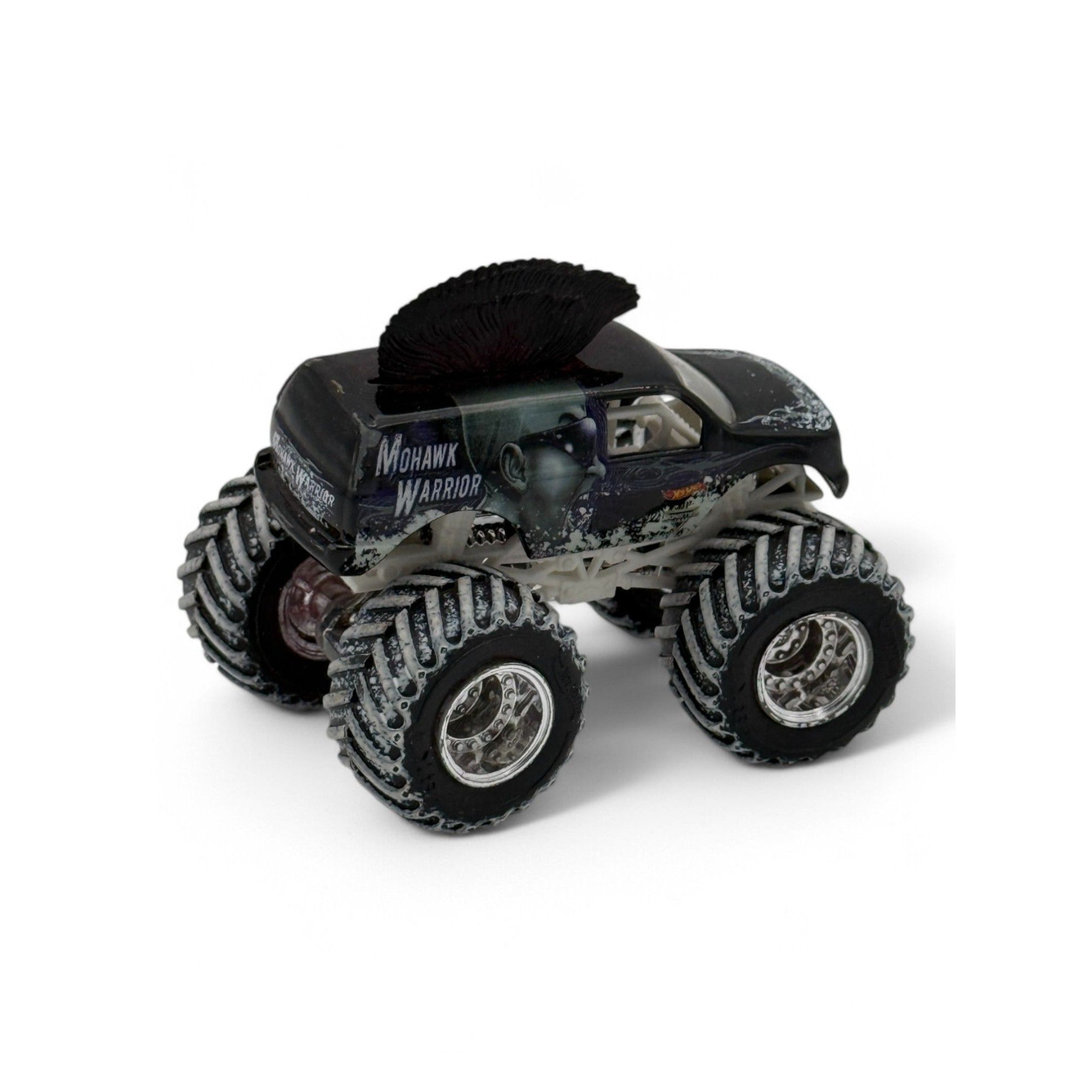 Mohawk Warrior truck with large tires and intricate graphics