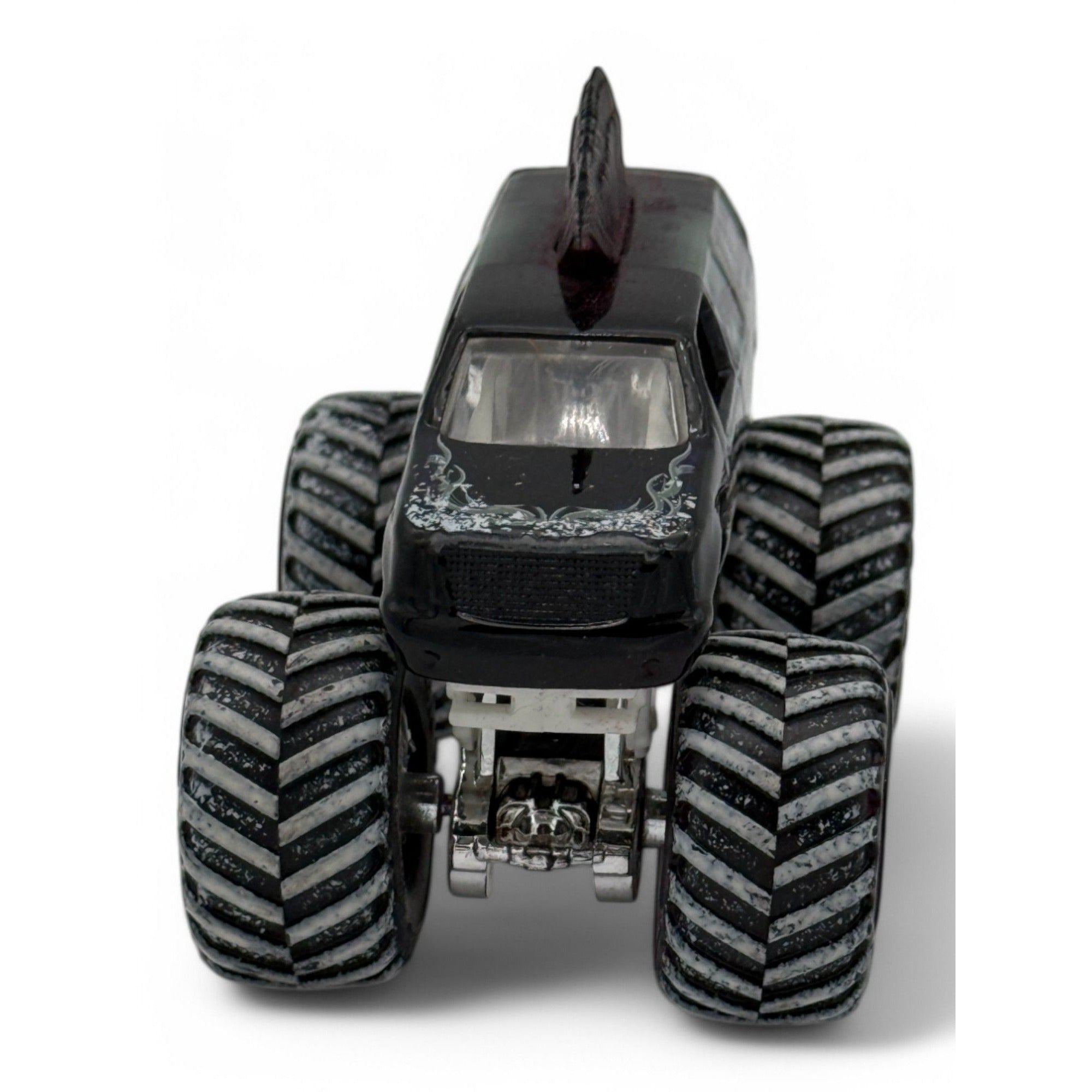 Detailed view of Mohawk Warrior truck's black mohawk and design