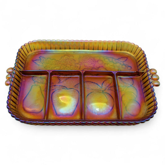 A vintage Indiana Glass amber carnival glass divided serving tray with embossed fruit motif and beaded handles, ideal for snacks or relishes.
