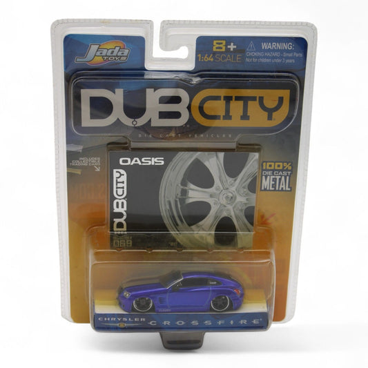 Jada Toys Dub City Chrysler Crossfire die-cast car in 1:64 scale features a metallic blue finish, includes Oasis series trading card, new in package.
