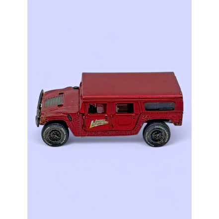Johnny Lightning 2000 Hummer H1 4-Door SUV diecast model in red, front view
