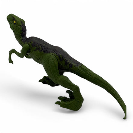Back view of the Jurassic World Velociraptor figure showing tail and limbs