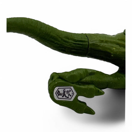 Green Velociraptor action figure with movable limbs from Jurassic World