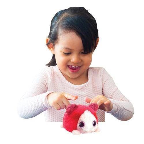 Child playing with red plush toy