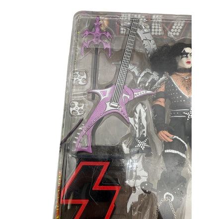 Side view of KISS Paul Stanley action figure with accessories