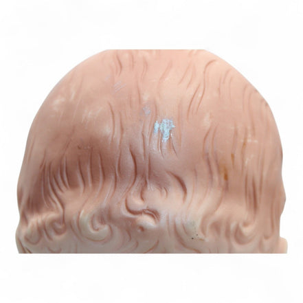 Close-up of Madame Alexander doll's head with painted hair