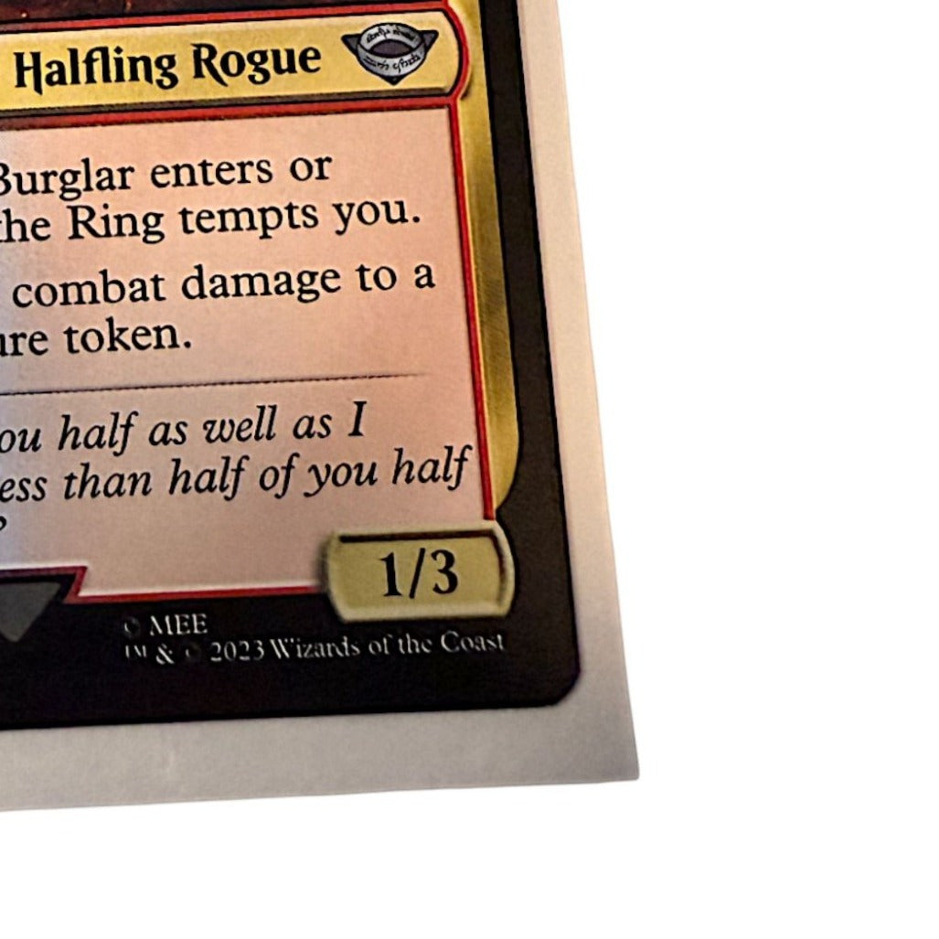 Magic: The Gathering Bilbo Retired Burglar card featuring Bilbo as a Halfling Rogue