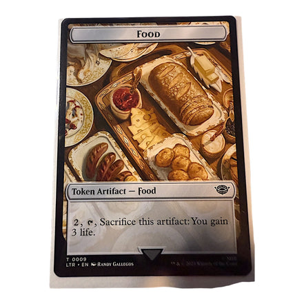 Magic: The Gathering card featuring Food token with bread and cheese platter