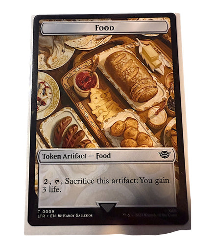 Magic: The Gathering card featuring Food token with bread and cheese platter