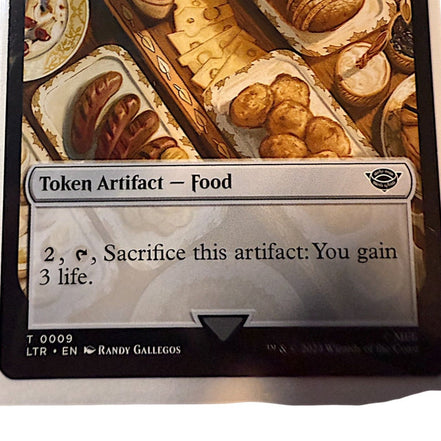 Magic: The Gathering card featuring Treasure token with gold coins and artifacts