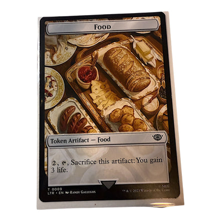 Magic The Gathering Food token card depicting a lavish spread of food items