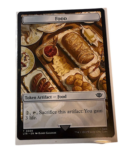 Magic The Gathering Food token card depicting a lavish spread of food items