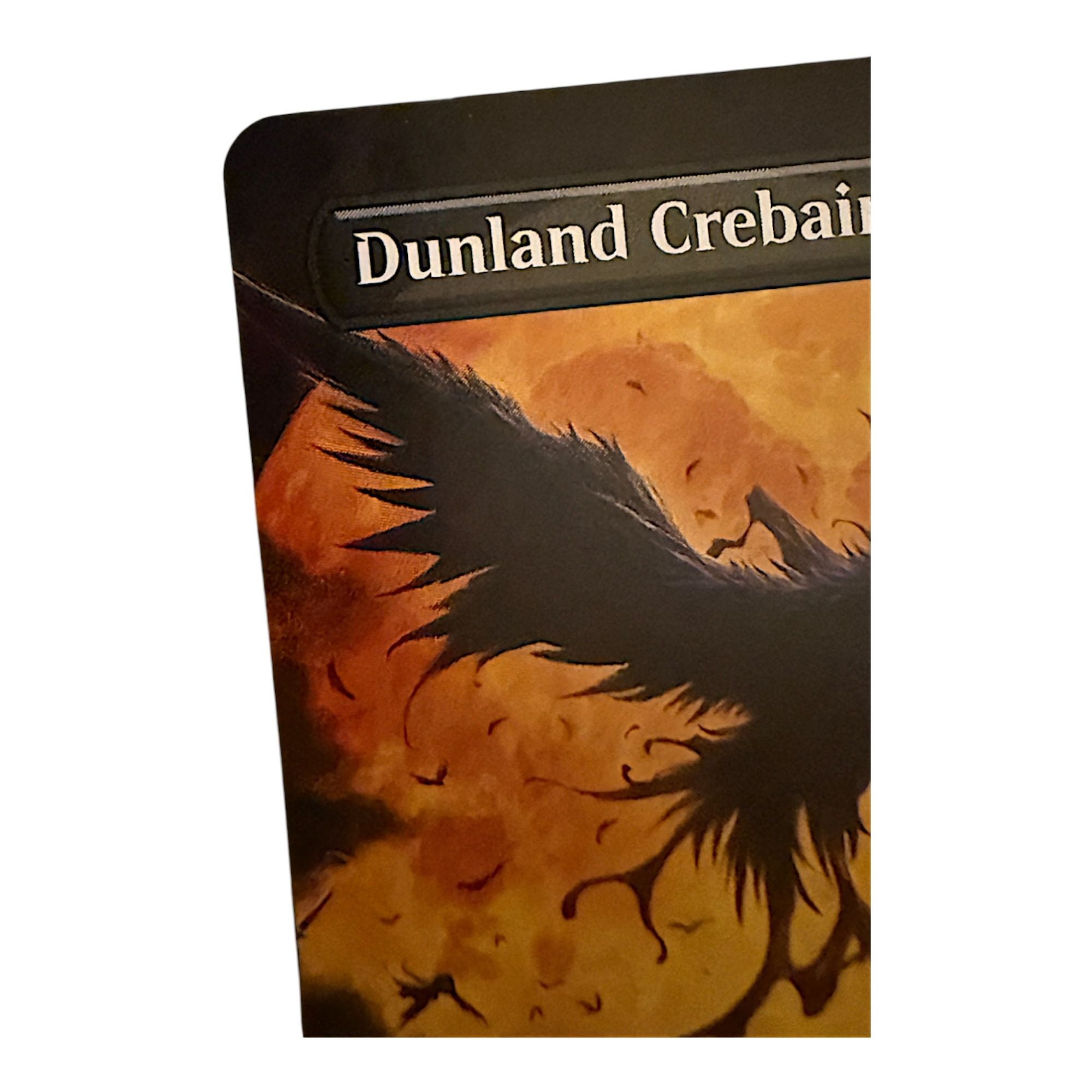 Close-up of Dunland Crebain card art showing a bird horror against a fiery background