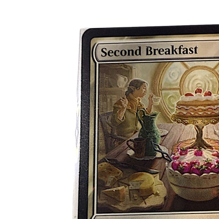 Close-up of the Second Breakfast card artwork with a hobbit enjoying breakfast