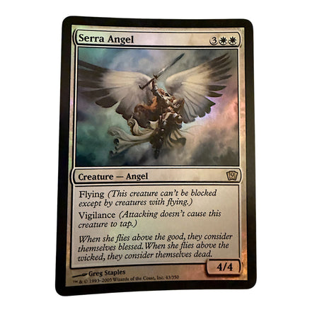 Magic The Gathering Serra Angel card featuring flying and vigilance abilities