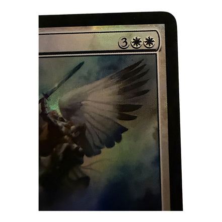 Close-up of Serra Angel card mana cost and abilities