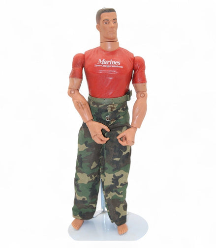 Marine action figure wearing a red shirt with 'Marines Honor Courage Commitment' and camouflage pants