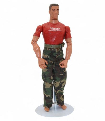 Side view of marine action figure with red shirt and camo pants
