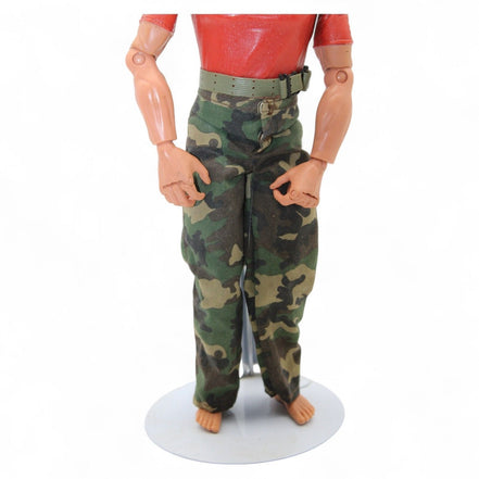 Marine action figure wearing a red shirt with 'Marines Honor Courage Commitment' and camouflage pants