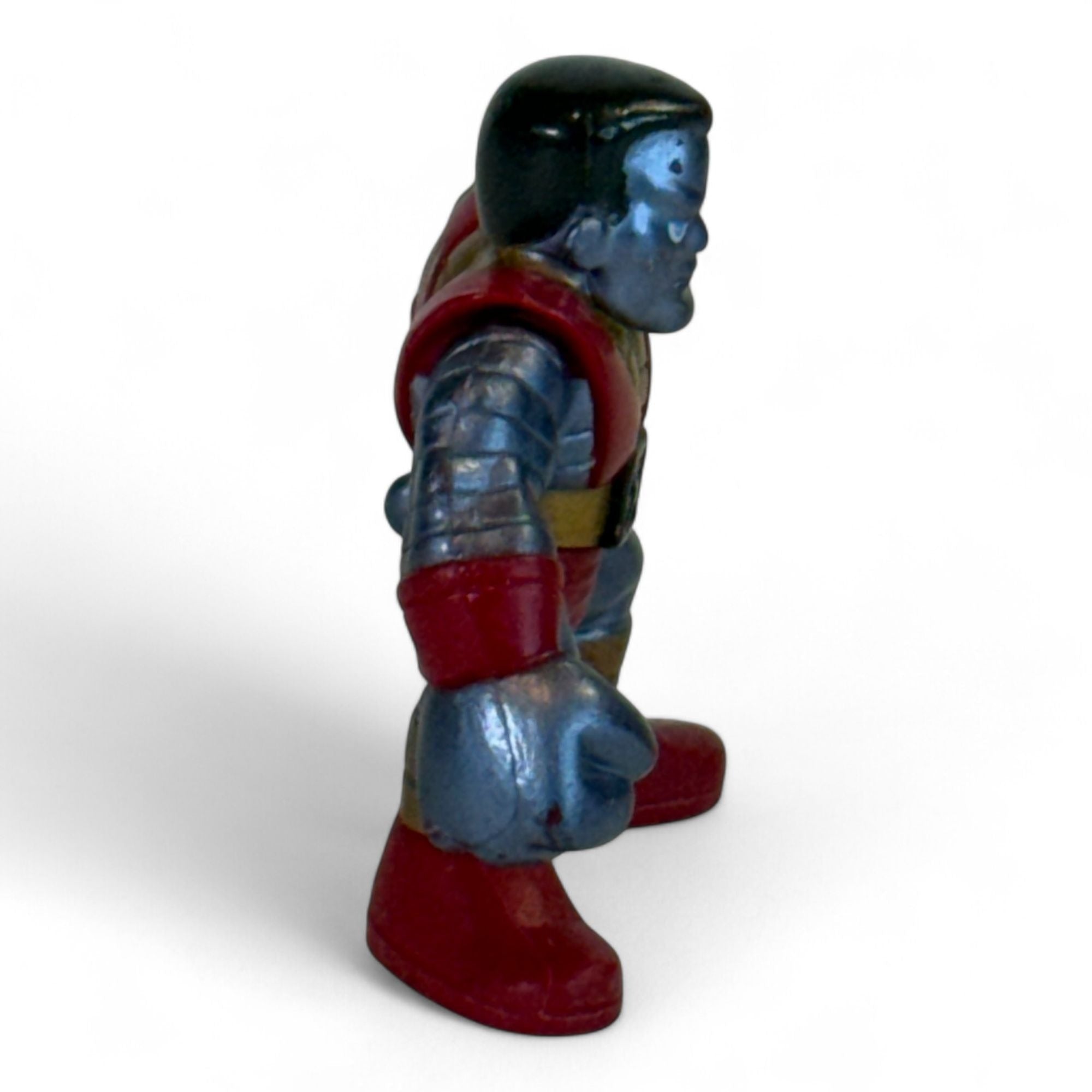 Colossus figure from the side highlighting muscular build