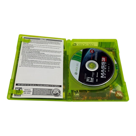 Open Xbox 360 case showing Mass Effect 3 disc and manual