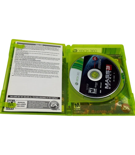 Open Xbox 360 case showing Mass Effect 3 disc and manual