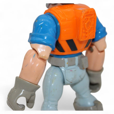 Detail of a Mattel Rescue Heroes figure's arm and vest