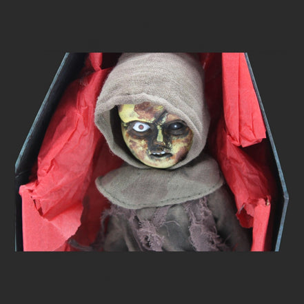 Full view of Menard Zombie Doll in tattered clothing