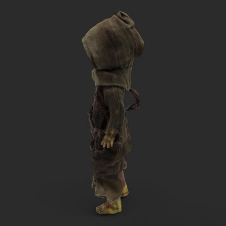Back view of Menard Zombie Doll highlighting the hooded cloak