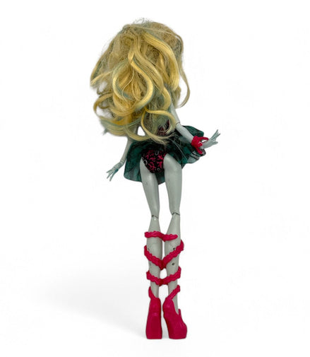 Back view of Monster High Lagoona Blue Doll showcasing blonde hair and pink heels