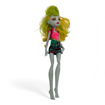 Side view of Monster High Lagoonafire Doll in pink and green outfit
