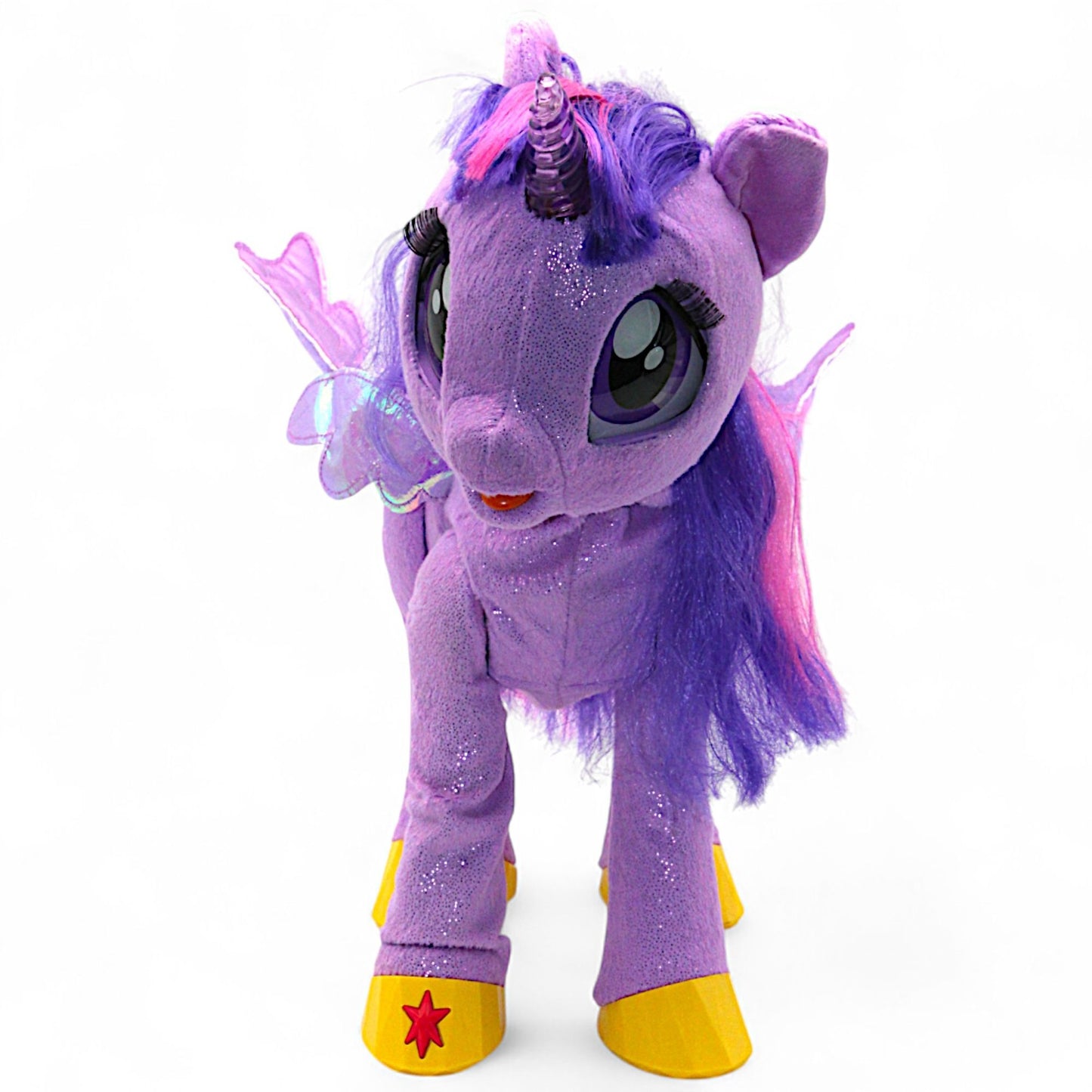 A talking and singing Princess Twilight Sparkle plush by Hasbro (My Magical Princess), with battery‑operated wings, horn light and tiara, interactive for play.

