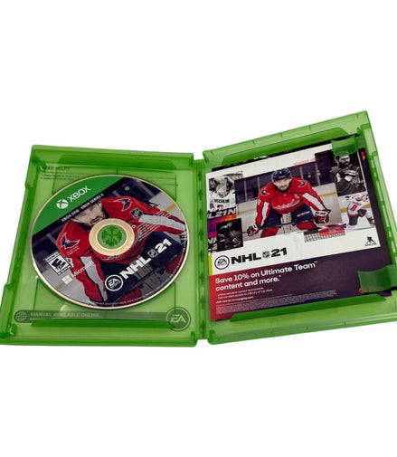 Open NHL 21 Xbox One game case showing the disc and manual.