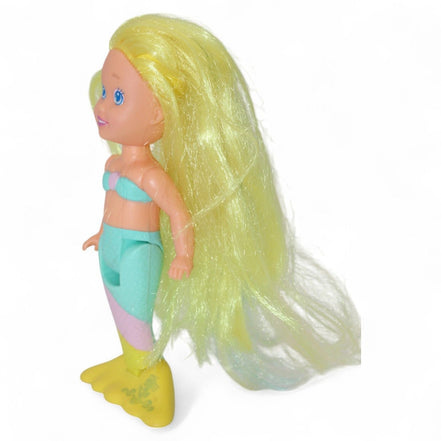 Side view of Playskool mermaid doll showing vibrant tail