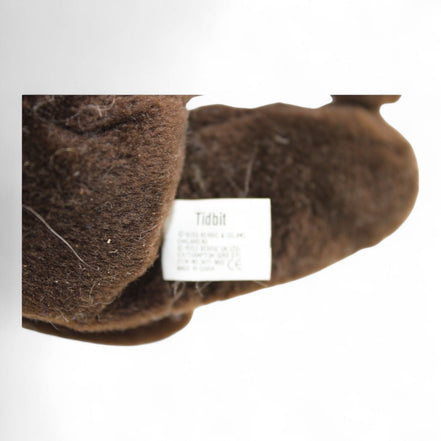 Close-up of the tag on Russ Berrie Tidbit plush teddy bear