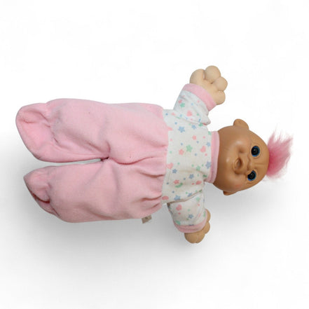 RUSS Troll Kidz Doll lying down in pink pajamas
