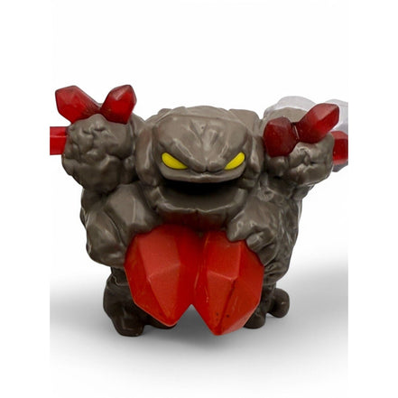 Rock-like Skylanders Happy Meal toy figure with red crystals