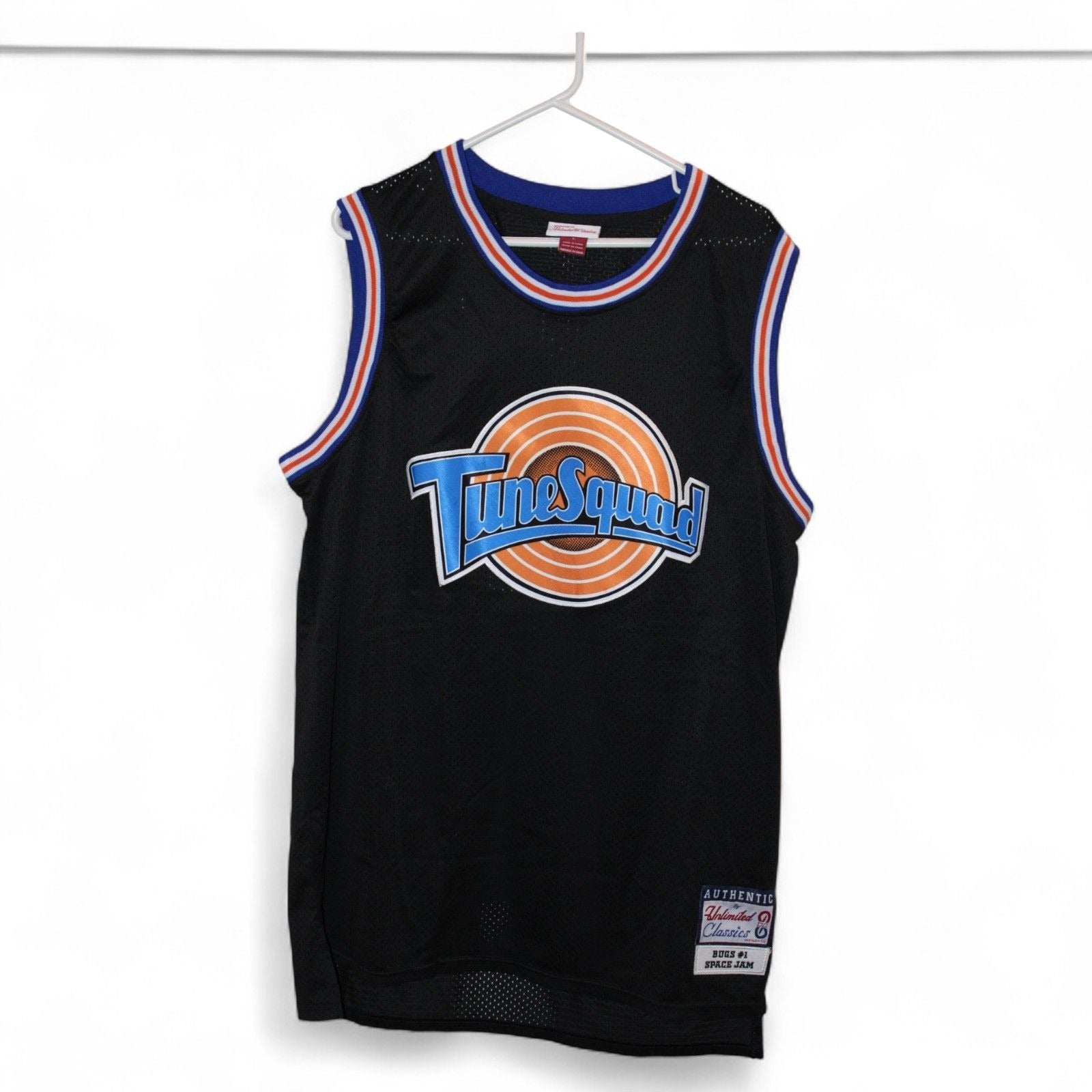 Space Jam Bugs #1 Tune Squad Black Basketball Jersey hanging on a hanger