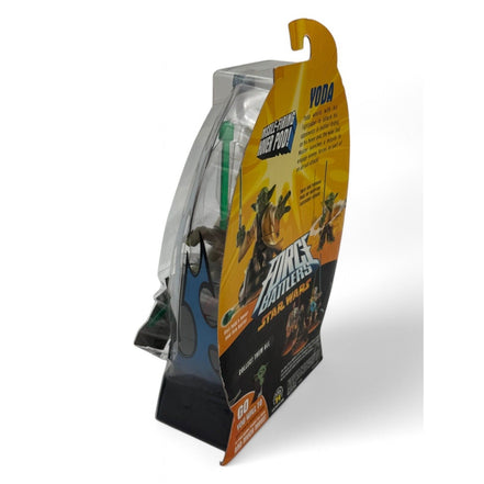 Yoda action figure with lightsaber in packaging