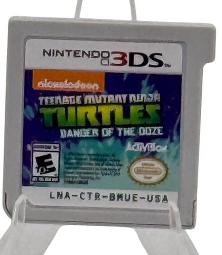 Front view of Teenage Mutant Ninja Turtles Danger of the Ooze Nintendo 3DS game cartridge