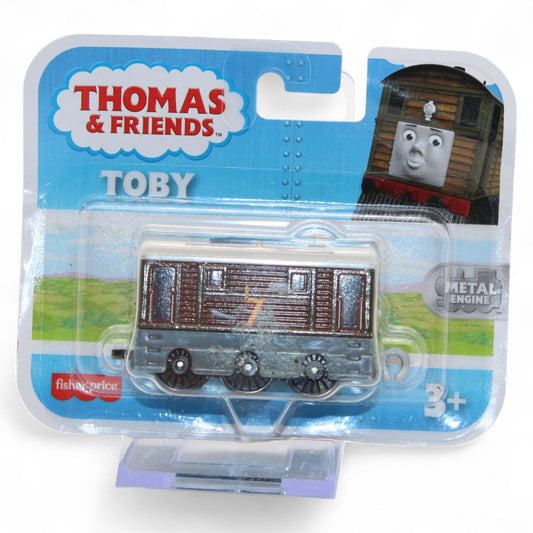 Thomas & Friends Toby metal engine by Fisher-Price is a detailed die-cast train for ages 3+, featuring classic brown and gray colors in new packaging.
