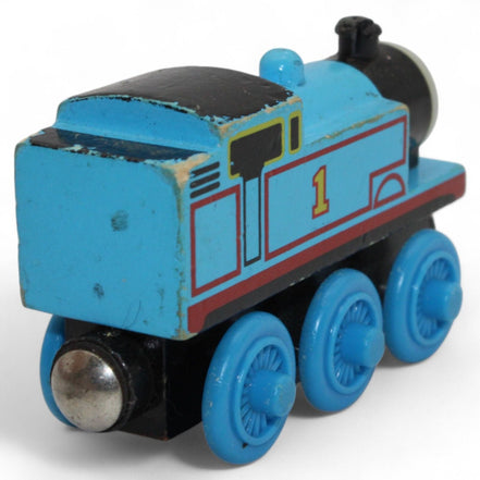 Bottom view of Thomas the Tank Engine wooden toy with name visible