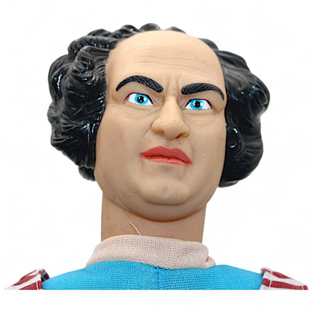 Close-up of the feet of the Three Stooges Larry plush doll